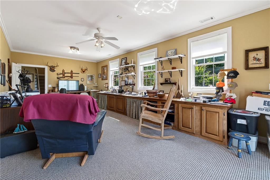 865 Laurel Ridge Road Cleveland, GA 30528 - Photo 58 of 81 a living room with furniture a window and a flat screen tv