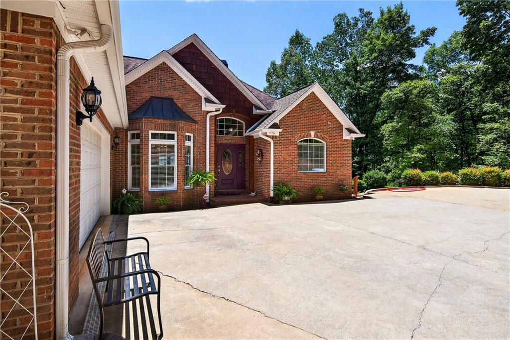 865 Laurel Ridge Road Cleveland, GA 30528 - Photo 7 of 81 a front view of a house with yard and trees
