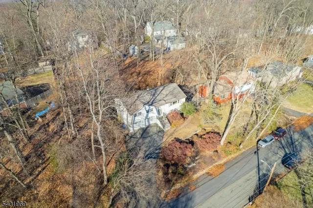 a view of a dining room with furniture and a chandelier