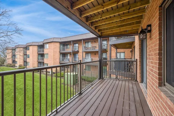 a view of a balcony with wooden floor