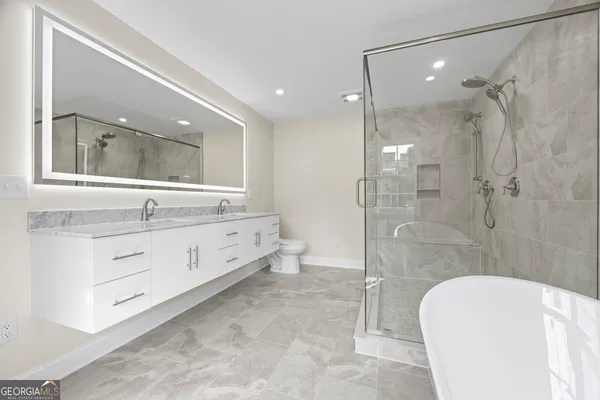 a white toilet sitting next to a window