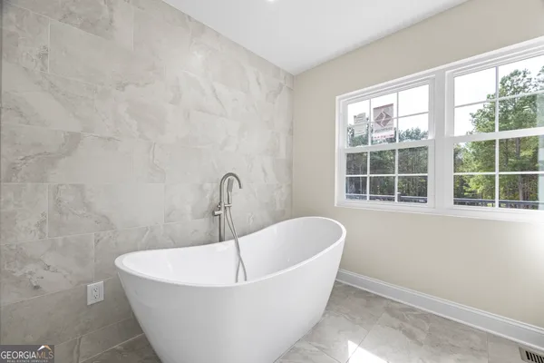 a view of a wooden floor and a window