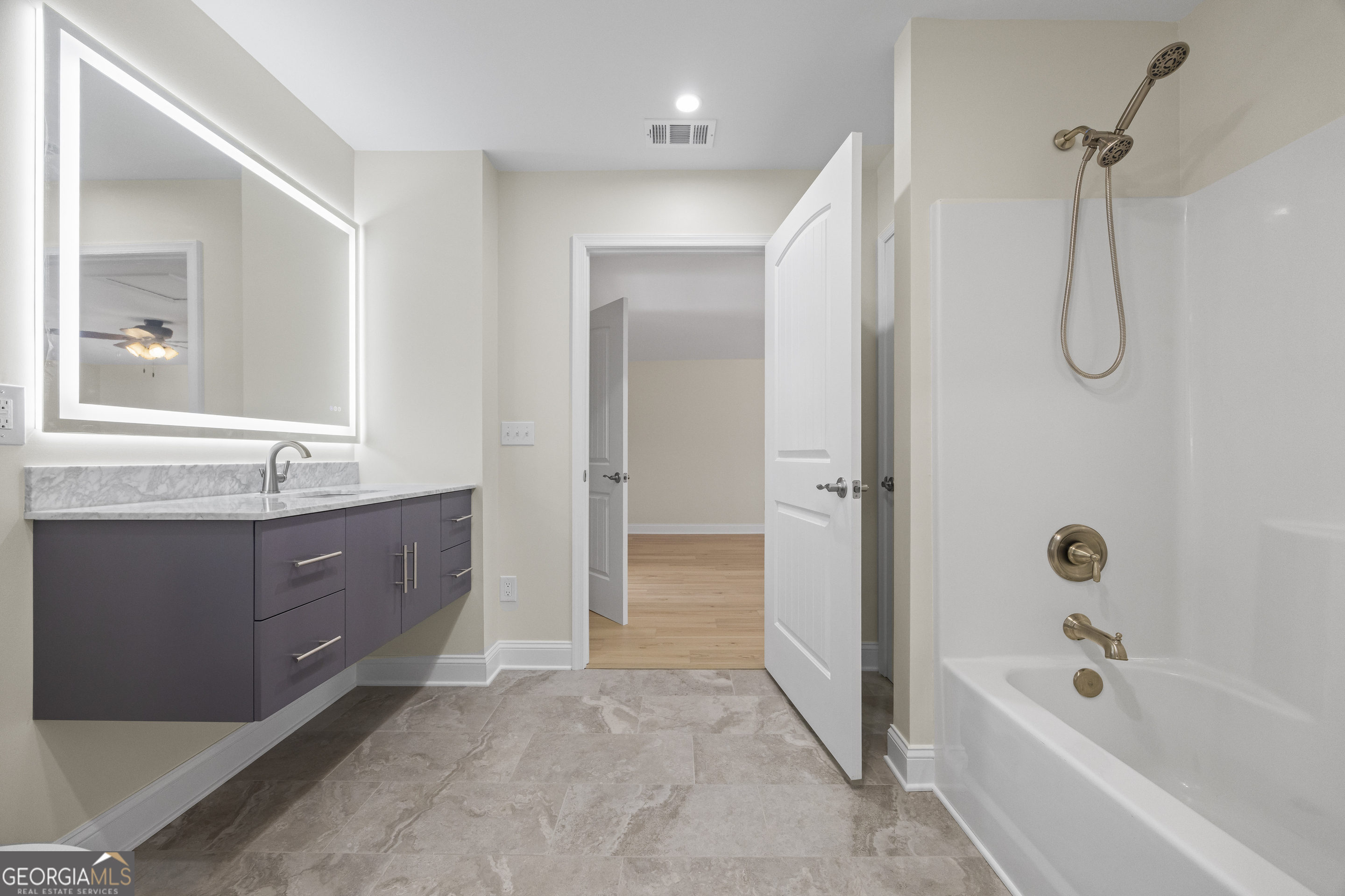 22 Anderson Thomas Road Martin, GA 30557 - Photo 68 of 110 a spacious bathroom with a tub sink shower and mirror