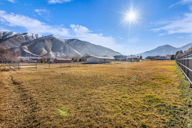1060 West 2620th Street South Mapleton, UT 84664 - Photo 69 of 87 View of mountain backdrop with rural landscape
