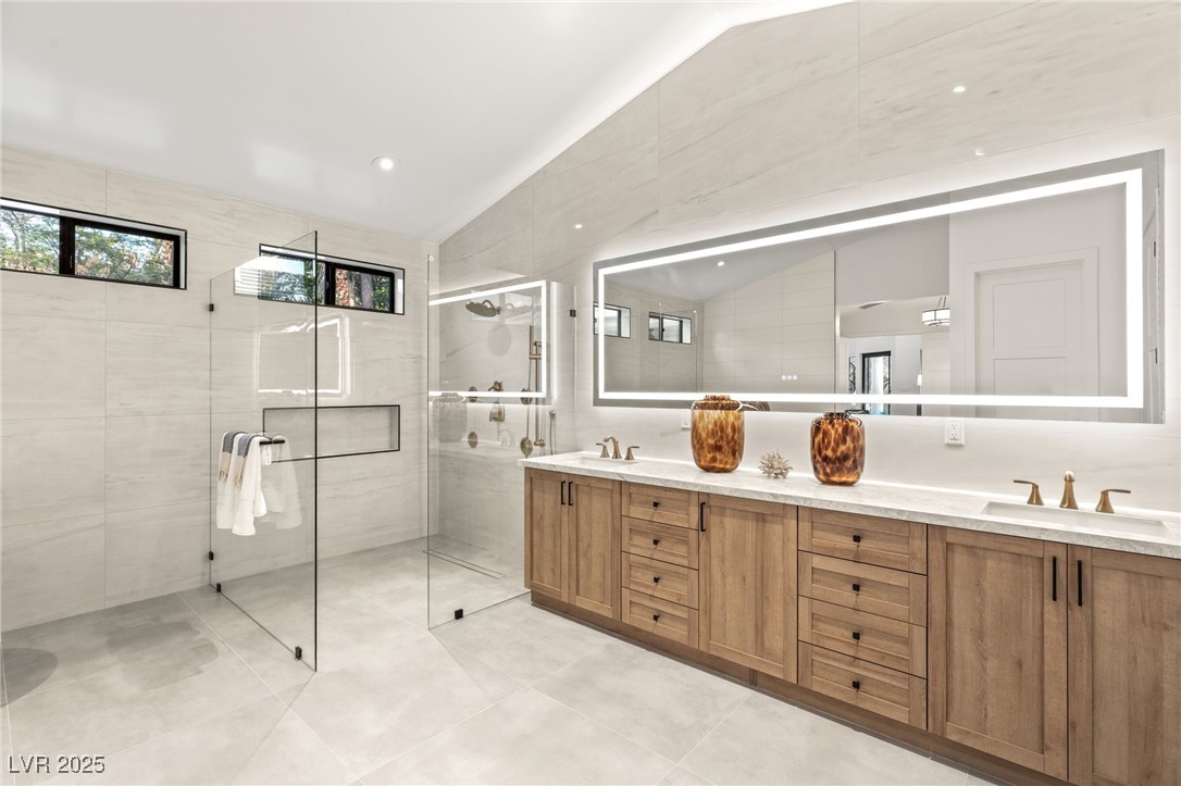 2316 Prometheus Court Henderson, NV 89074 - Photo 29 of 92 Bathroom with a shower stall, double vanity, a sink, and tile walls