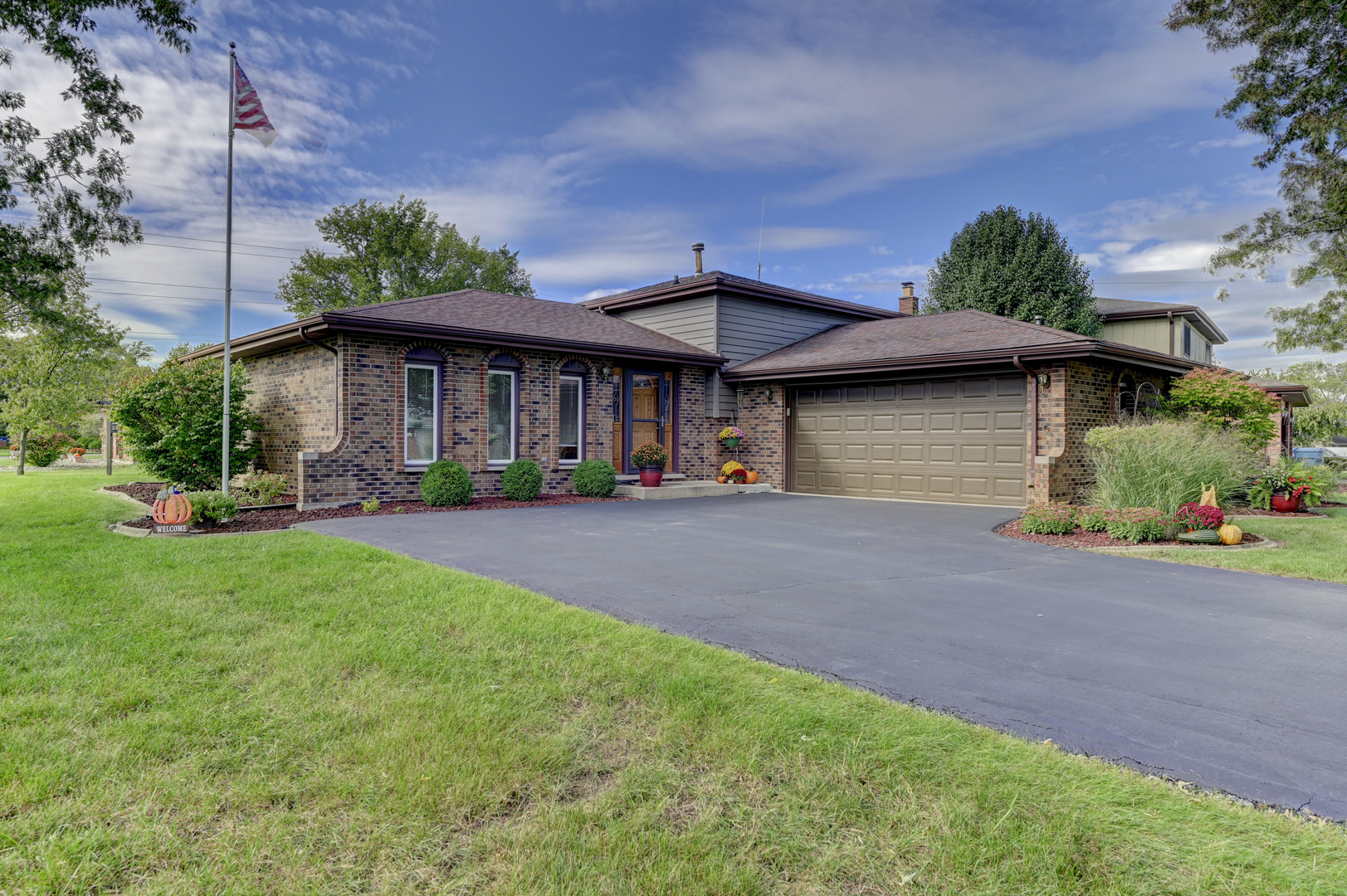 a front view of a house with garden