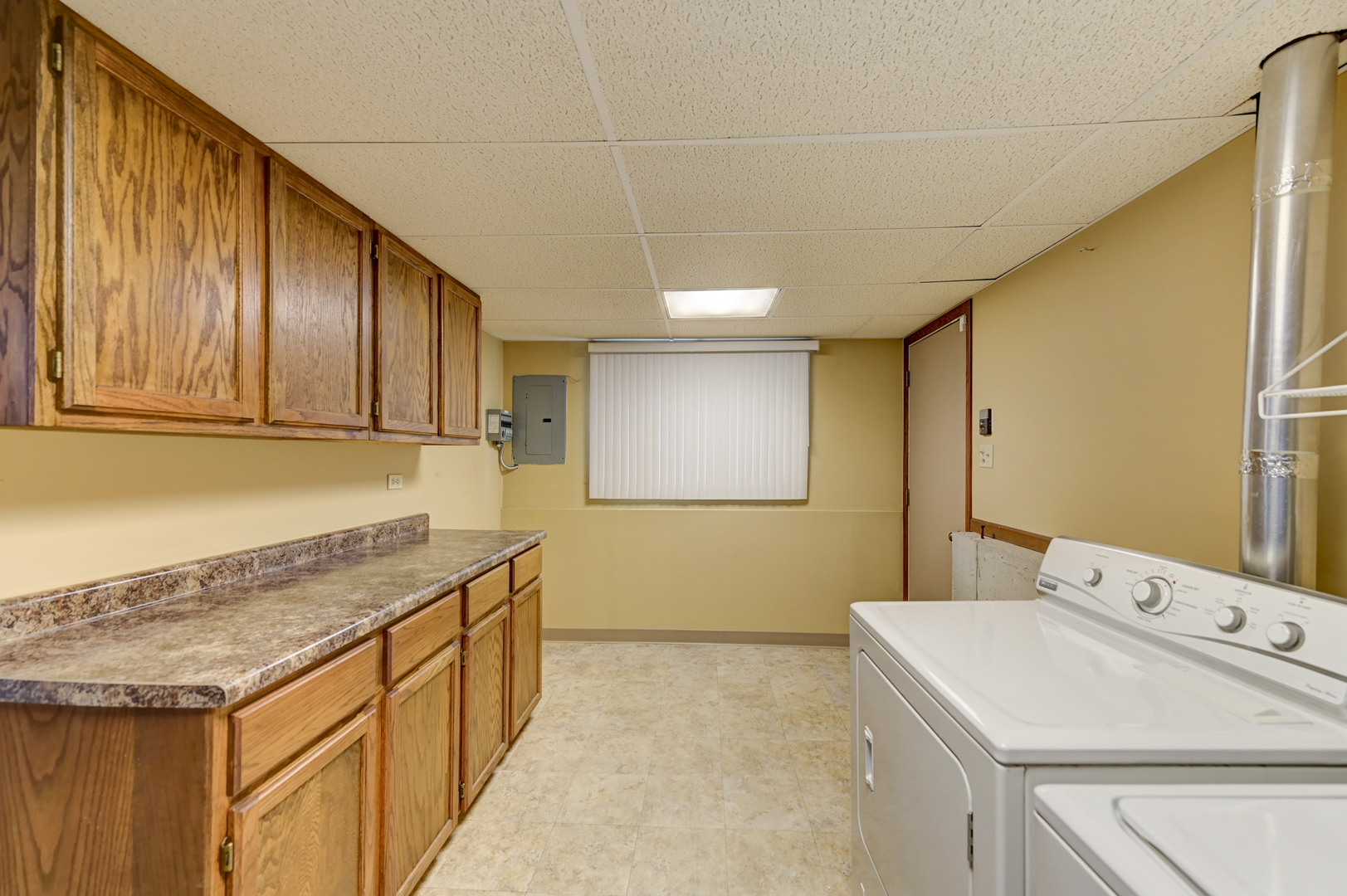 3484 Gilbert Court Crete, IL 60417 - Photo 13 of 18 a utility room with granite countertop cabinets washer and dryer