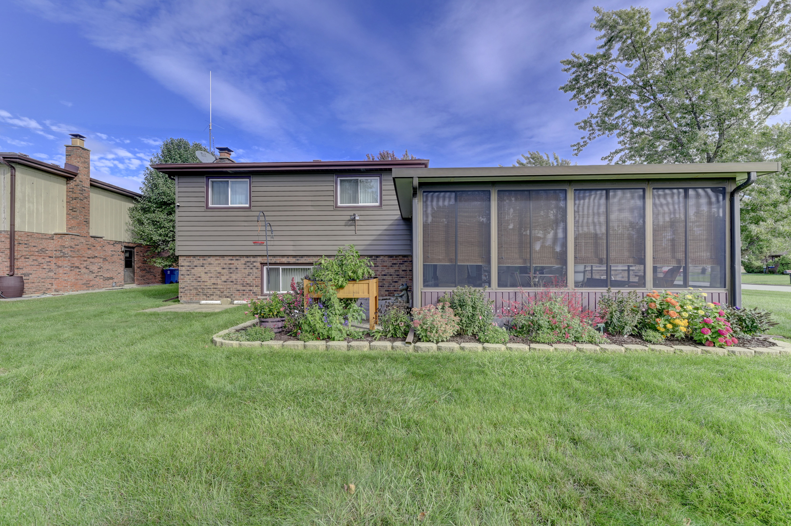 3484 Gilbert Court Crete, IL 60417 - Photo 16 of 18 a front view of a house with a garden and yard