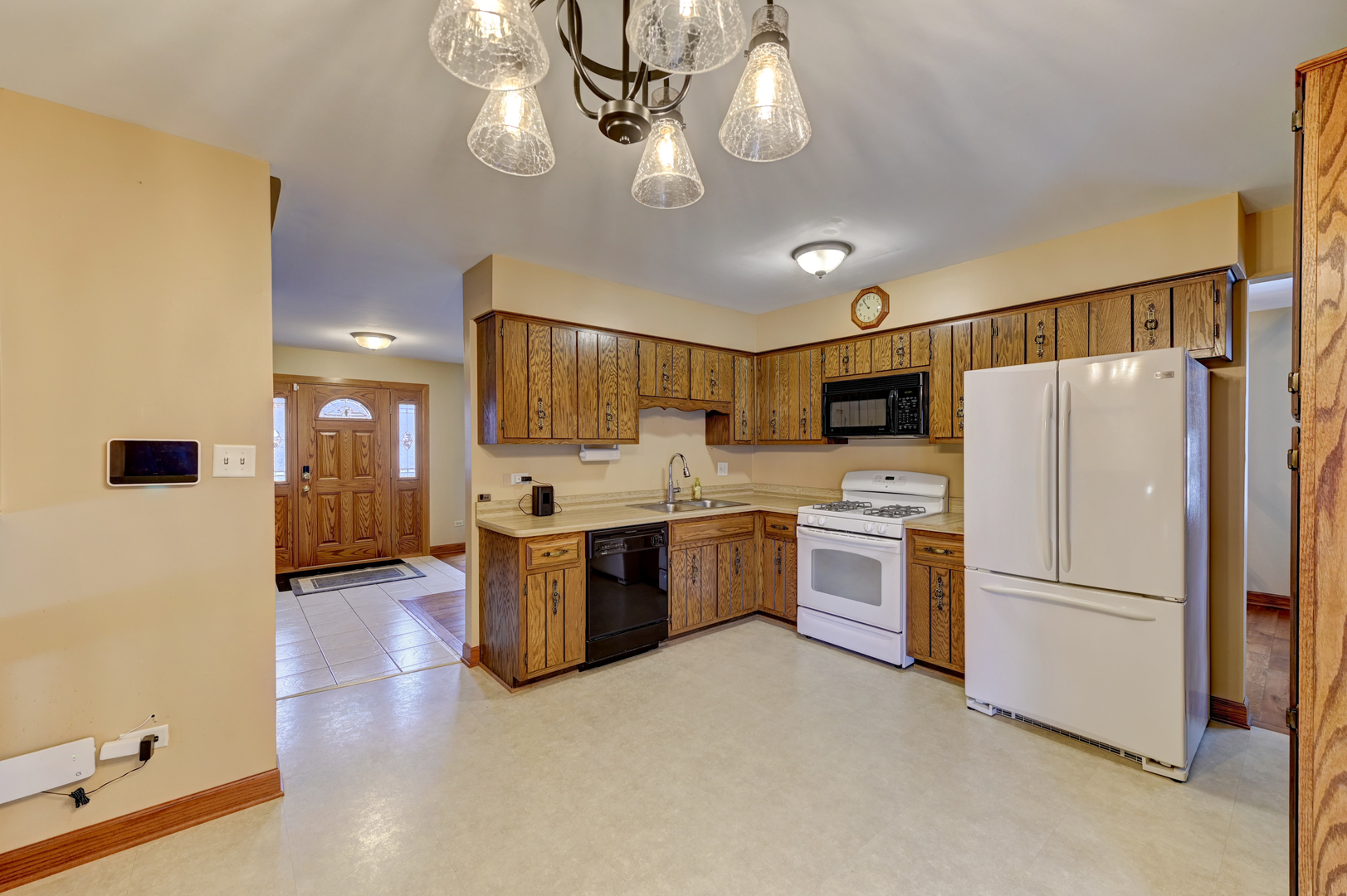 3484 Gilbert Court Crete, IL 60417 - Photo 4 of 18 a kitchen with a refrigerator a stove top oven a sink and dishwasher