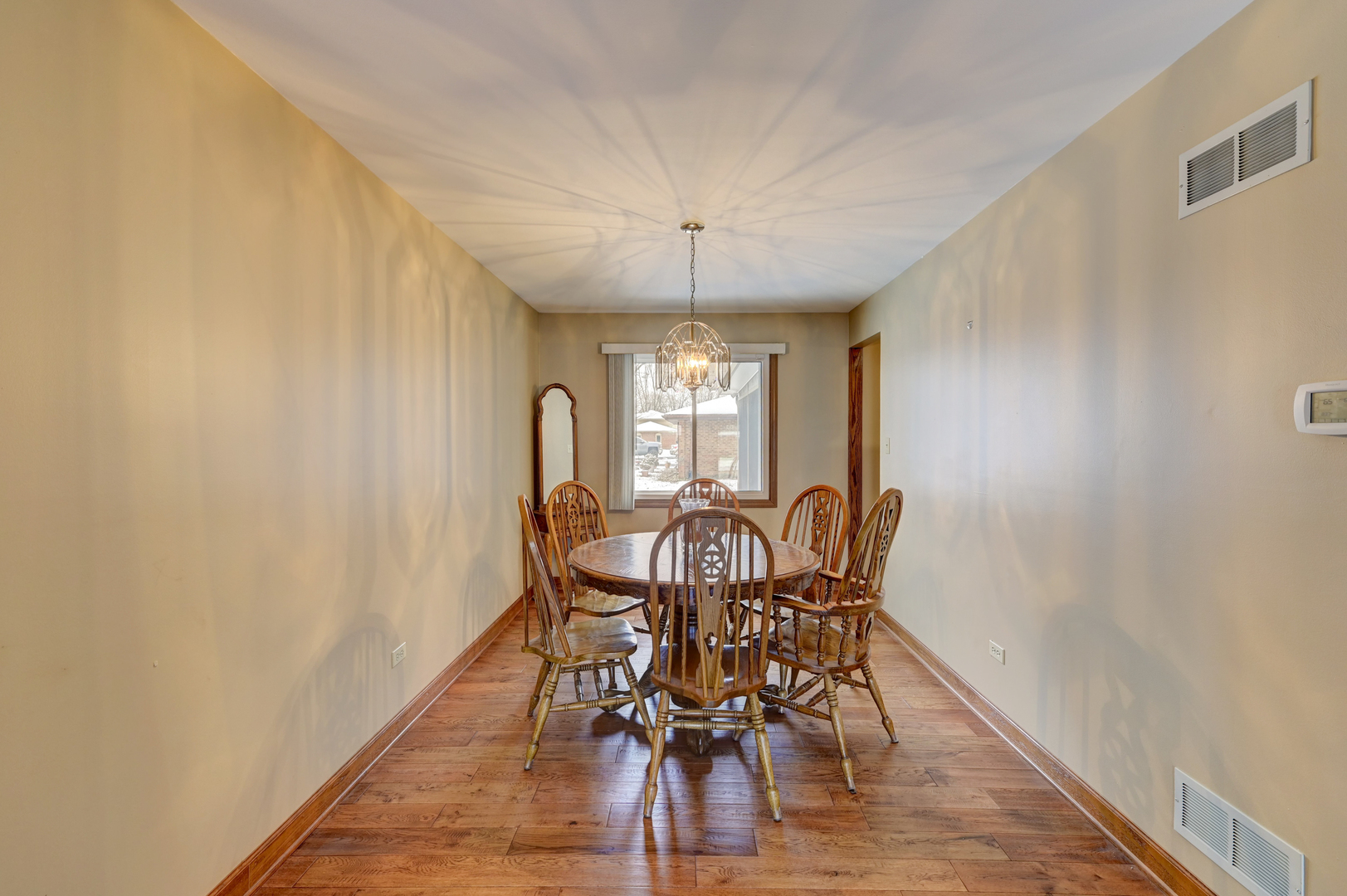 3484 Gilbert Court Crete, IL 60417 - Photo 5 of 18 a view of a dining room with furniture window and wooden floor