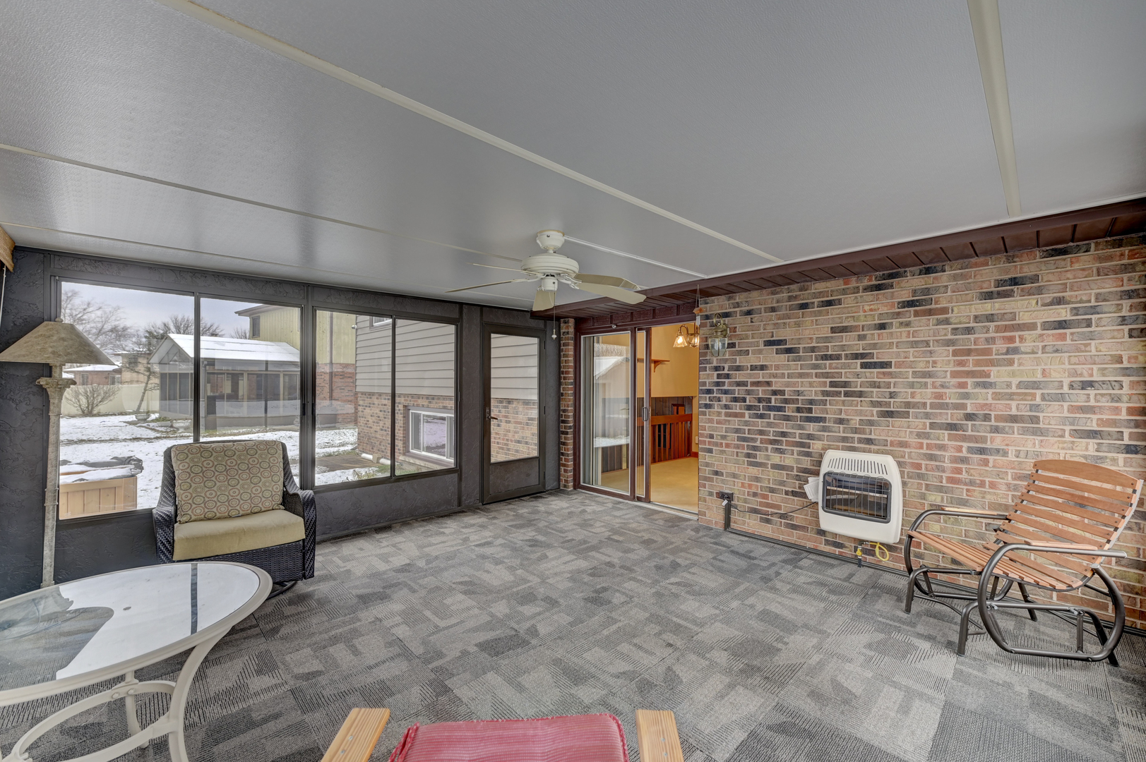 3484 Gilbert Court Crete, IL 60417 - Photo 6 of 18 a living room with furniture a fireplace and a floor to ceiling window