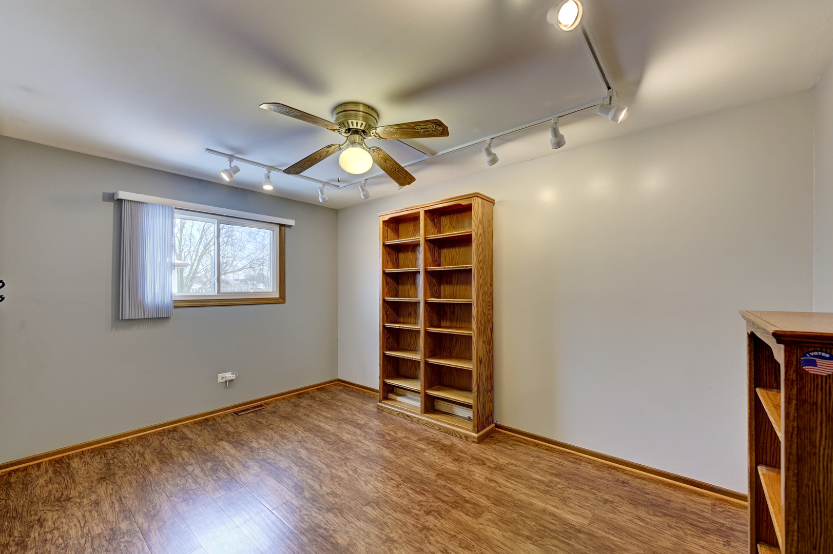 3484 Gilbert Court Crete, IL 60417 - Photo 8 of 18 a view of an empty room with a window and wooden floor
