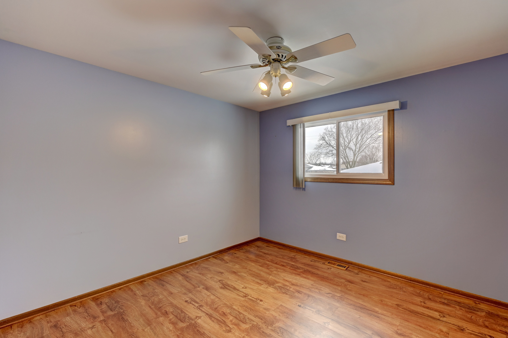 3484 Gilbert Court Crete, IL 60417 - Photo 10 of 18 a view of an empty room with wooden floor and a fan