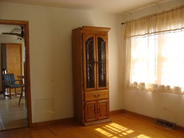 10819 Menard Avenue Chicago Ridge, IL 60415 - Photo 5 of 8 a view of a closet area with an empty room