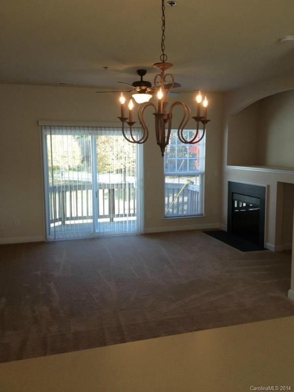 2814 Avalon Loop Road, Unit 2814 Charlotte, NC 28269 - Photo 4 of 7 a view of an empty room with a fireplace