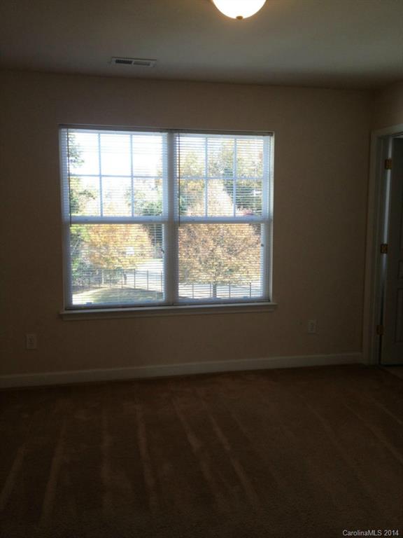 2814 Avalon Loop Road, Unit 2814 Charlotte, NC 28269 - Photo 5 of 7 a view of an empty room with a window