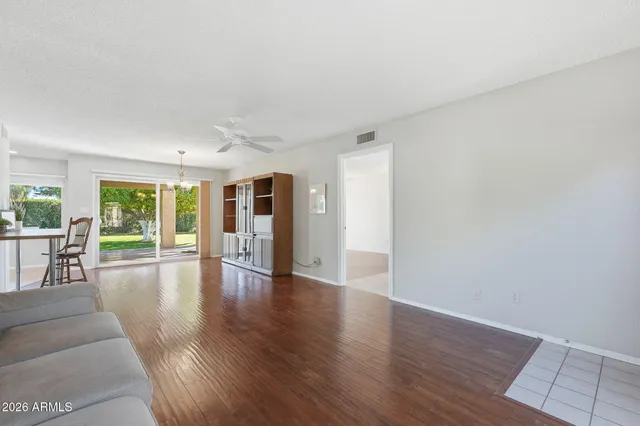 a view of a livingroom with furniture window and wooden floor