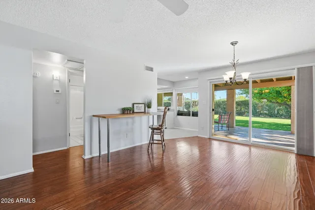 a view of a kitchen with a sink and cabinets