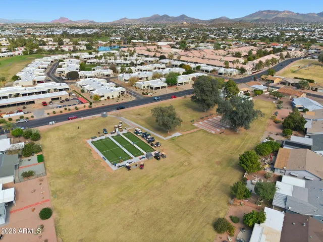 an aerial view of residential houses with outdoor space