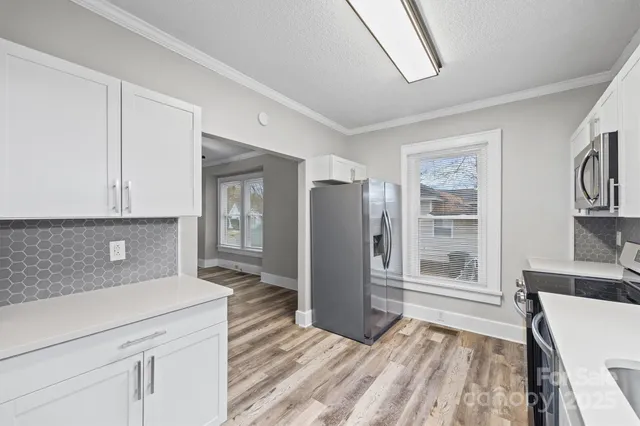 a kitchen with a stove and a microwave
