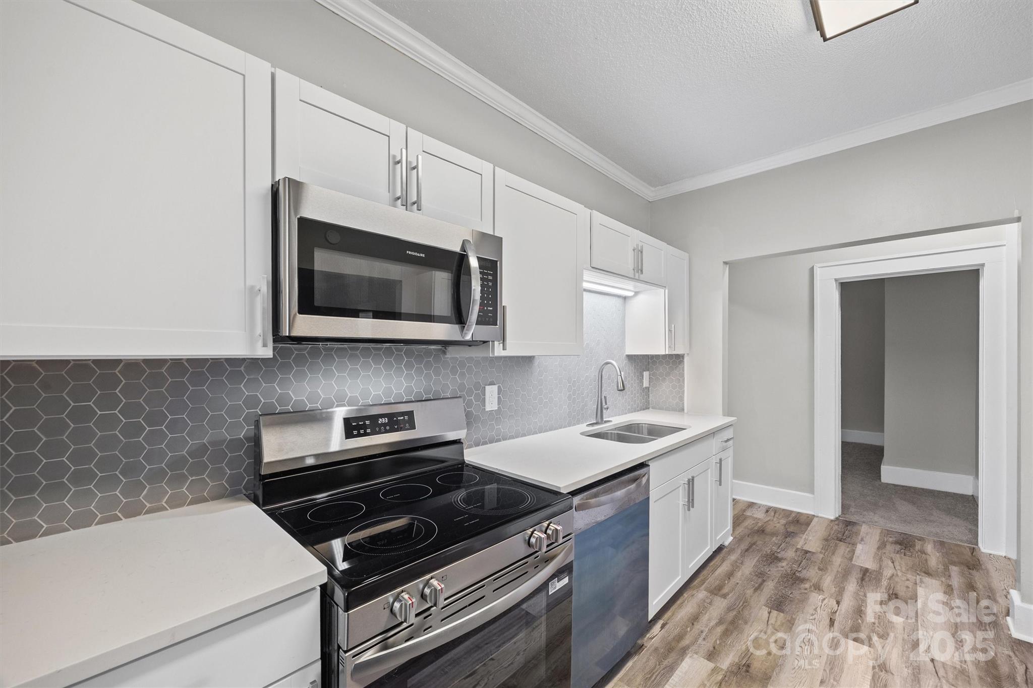 548 Flint Street Rock Hill, SC 29730 - Photo 13 of 28 a kitchen with a stove and a microwave