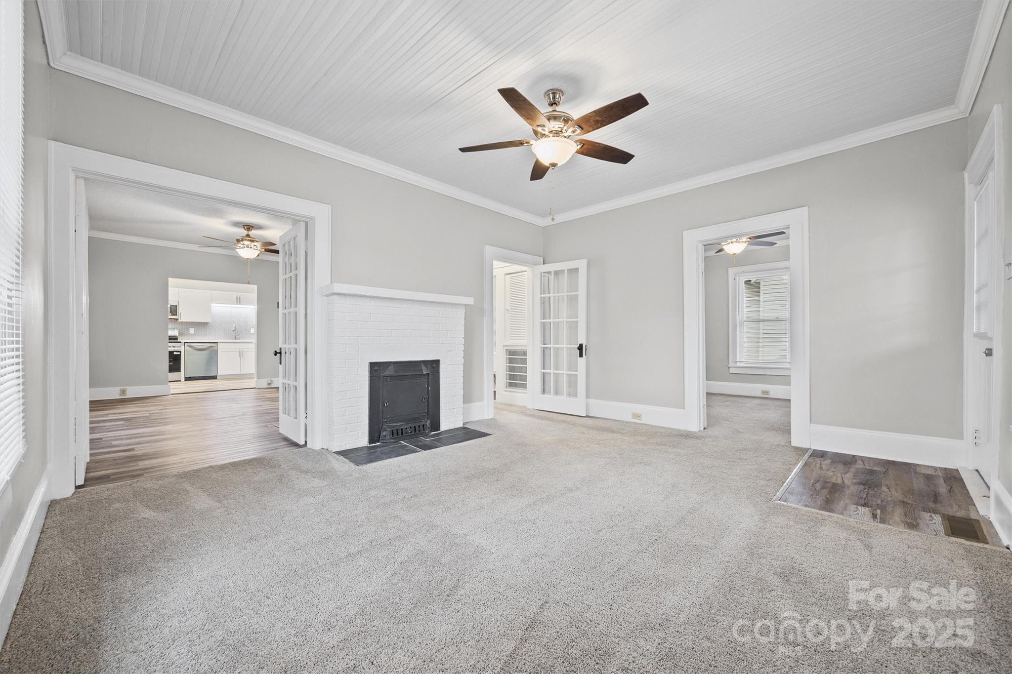 548 Flint Street Rock Hill, SC 29730 - Photo 6 of 28 an empty room with fireplace and windows