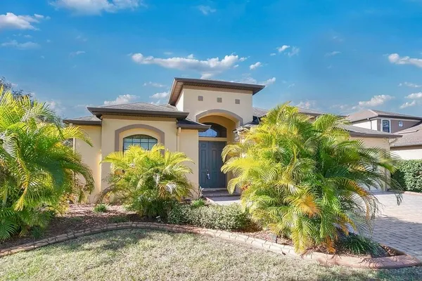 a front view of a house with a yard