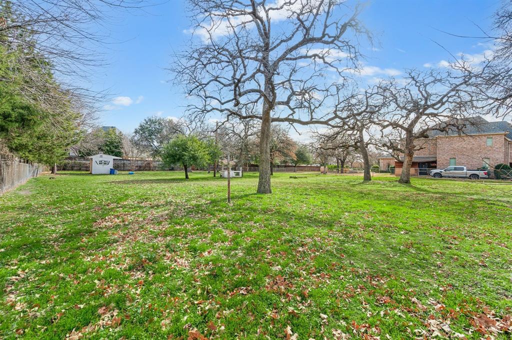 6701 Herbert Road Colleyville, TX 76034 - Photo 14 of 22 a view of a trees with a big yard