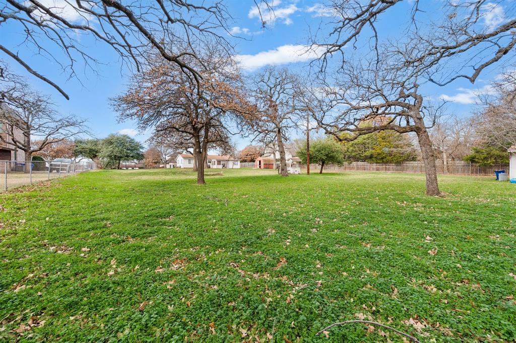6701 Herbert Road Colleyville, TX 76034 - Photo 16 of 22 a view of a field with a tree