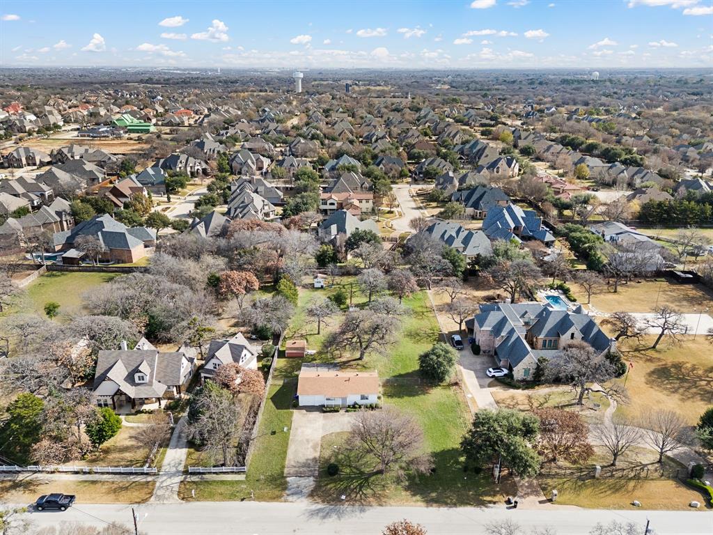 6701 Herbert Road Colleyville, TX 76034 - Photo 8 of 22 an aerial view of residential houses with outdoor space