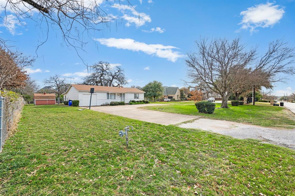 6701 Herbert Road Colleyville, TX 76034 - Photo 9 of 22 a view of a house with a yard