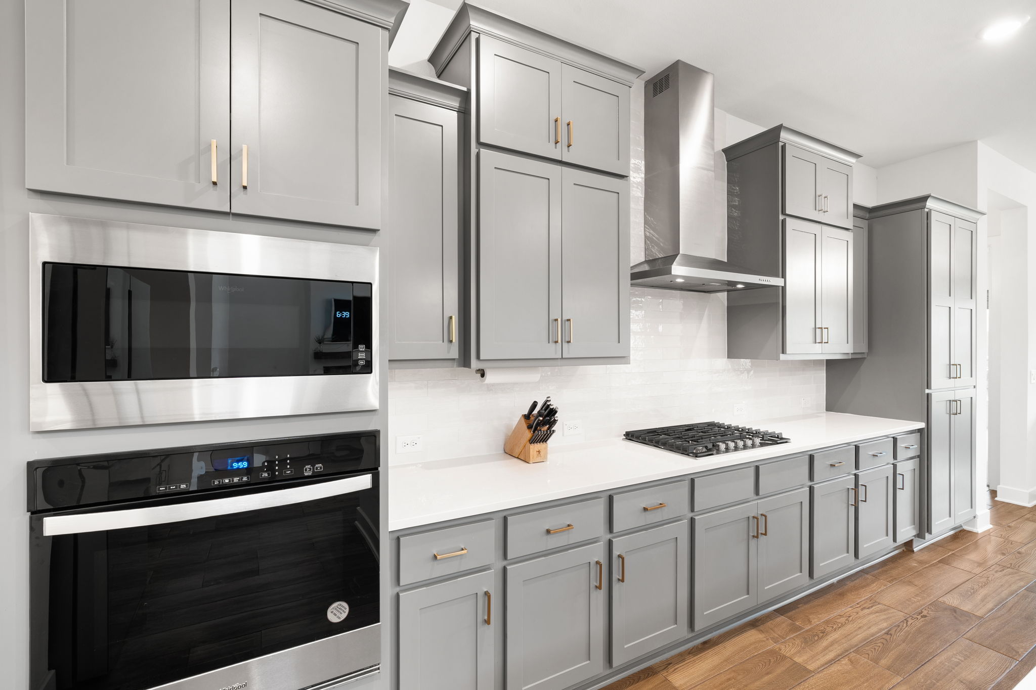 515 Watershield Cove Georgetown, TX 78633 - Photo 16 of 40 Culinary excellence awaits in this kitchen featuring abundant gray cabinetry, stainless steel appliances, and sleek countertops.