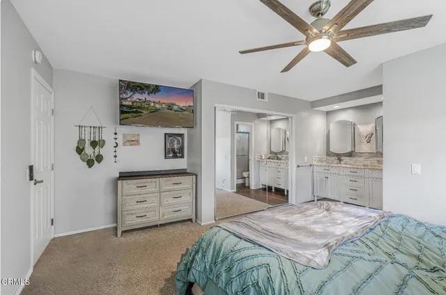 a bathroom with a glass shower door