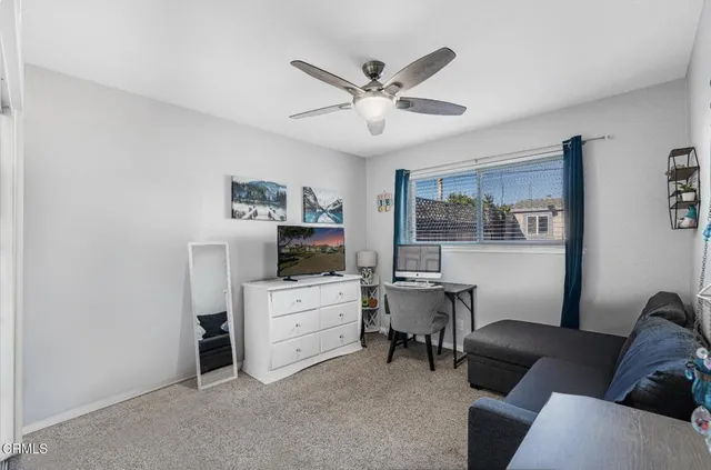 a backyard of a house with yard and outdoor seating