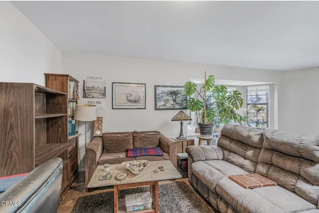 a dining area with stainless steel appliances granite countertop a dining table and chairs