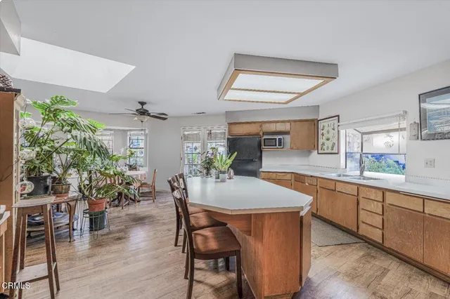 a kitchen with a sink and a stove top oven