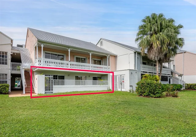 a front view of house with yard and outdoor seating