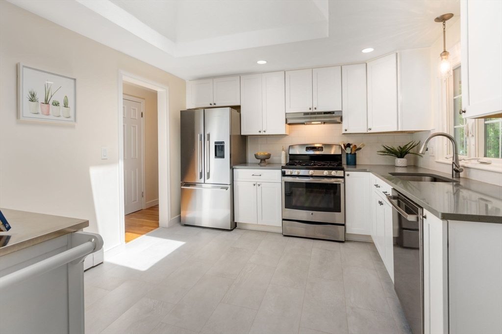 11 Longmeadow Road Medfield, MA 02052 - Photo 8 of 39 a kitchen with a stove sink and refrigerator