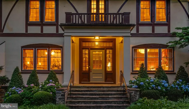 a front view of a house with large windows