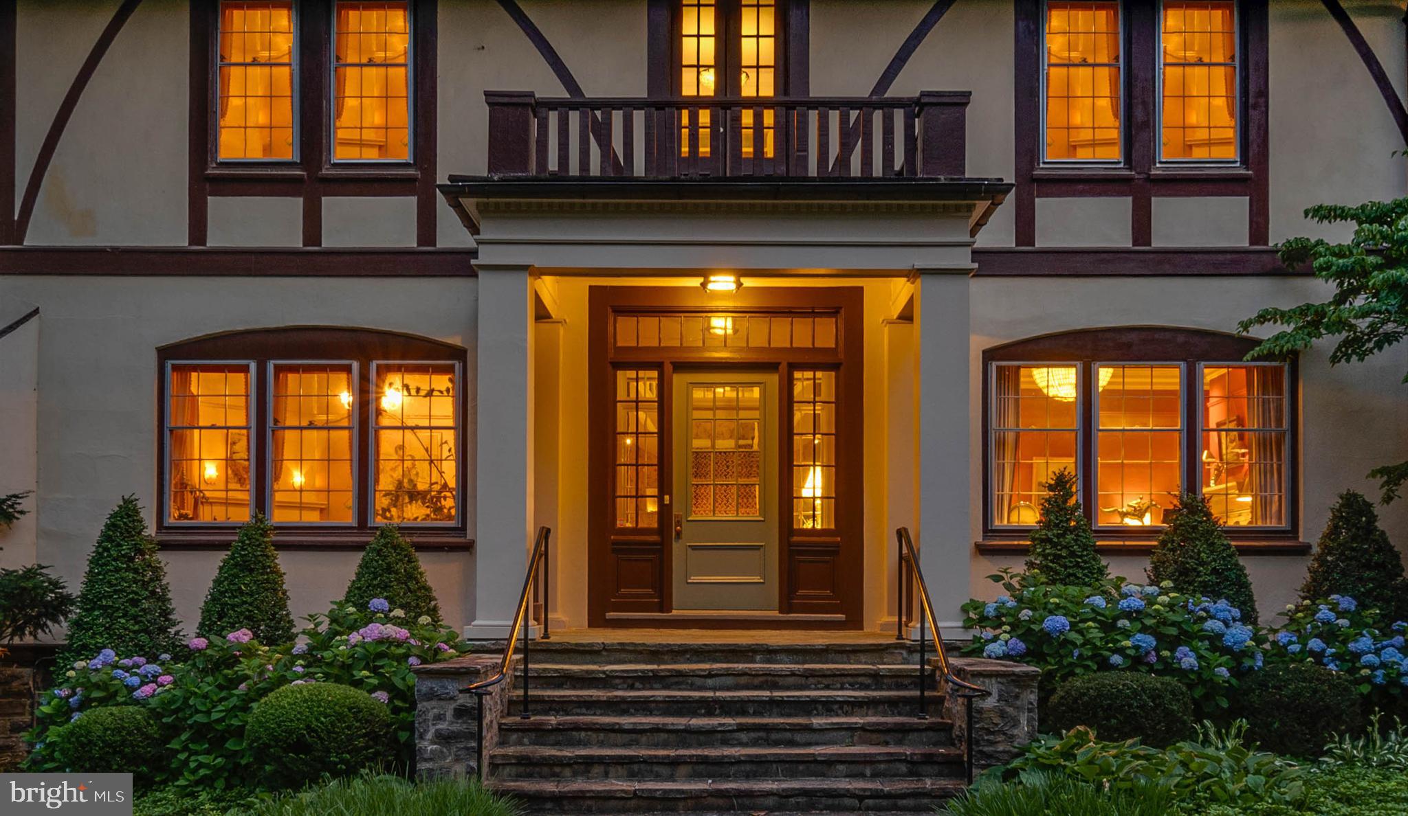 a front view of a house with large windows