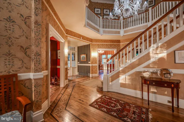 an aerial view of a house with a yard basket ball court and outdoor seating