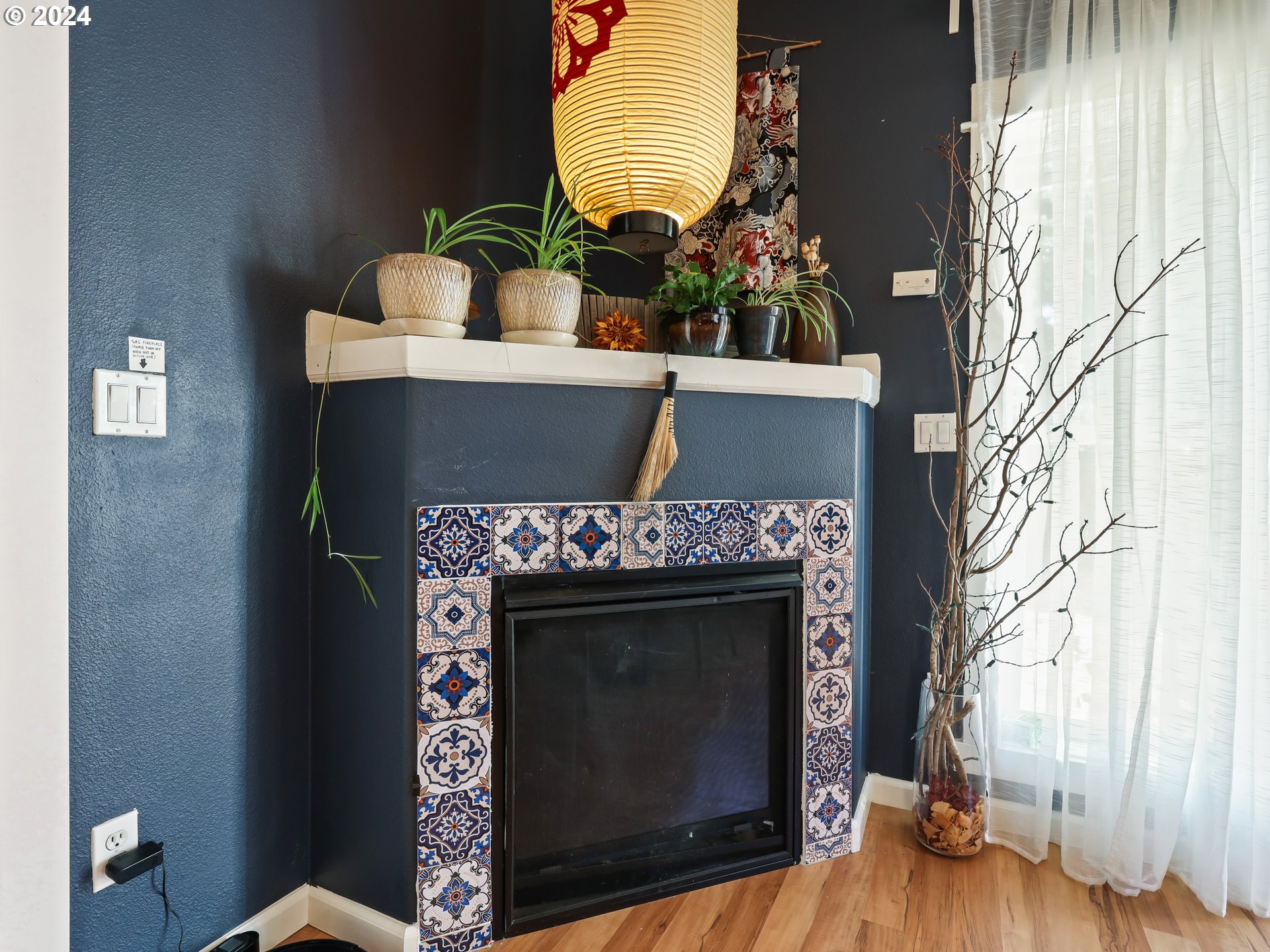 6924 Southeast Boise Street Portland, OR 97206 - Photo 13 of 45 a living room with furniture and a fireplace