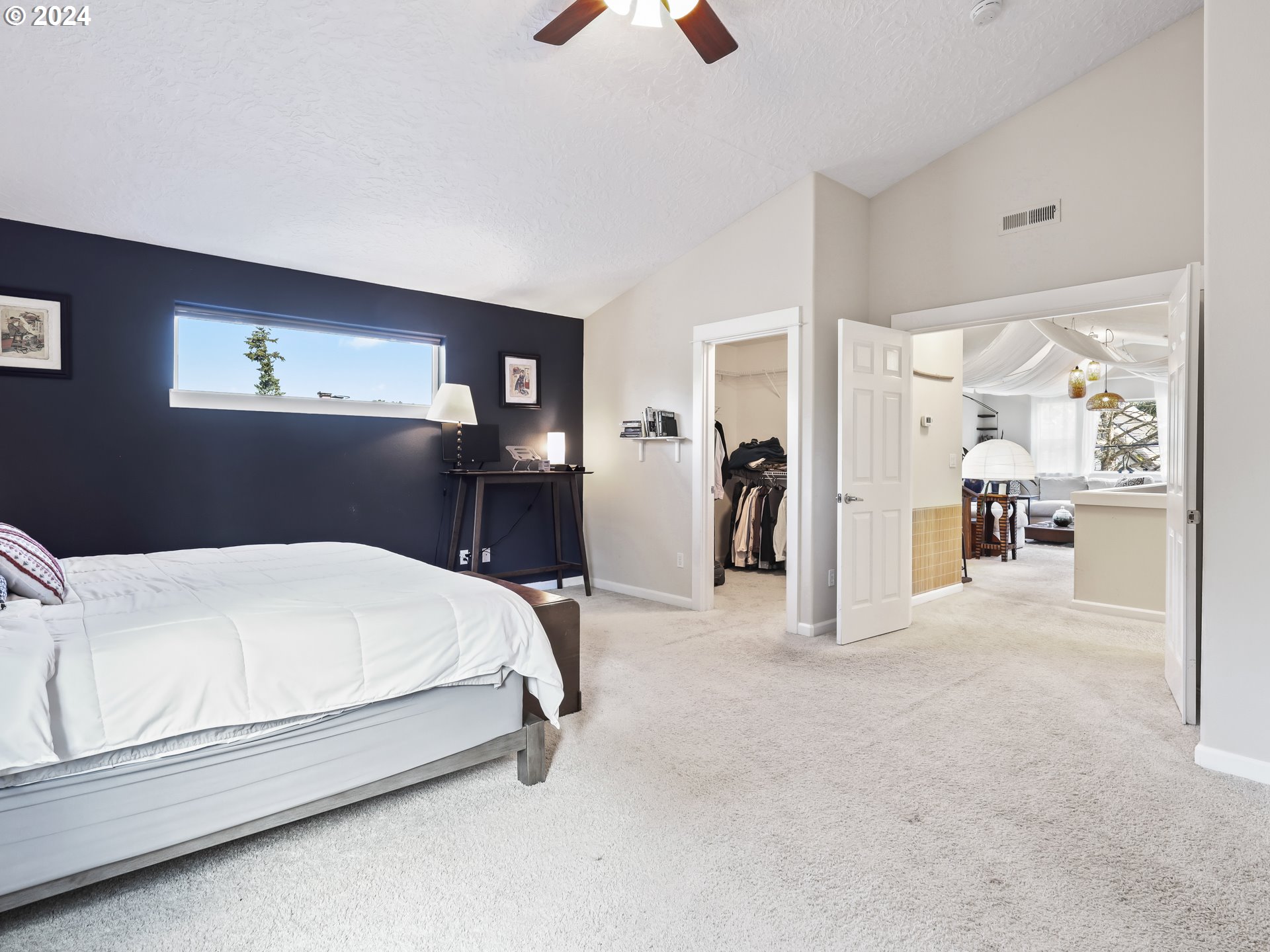 6924 Southeast Boise Street Portland, OR 97206 - Photo 26 of 45 a bed room with a bed and a chandelier