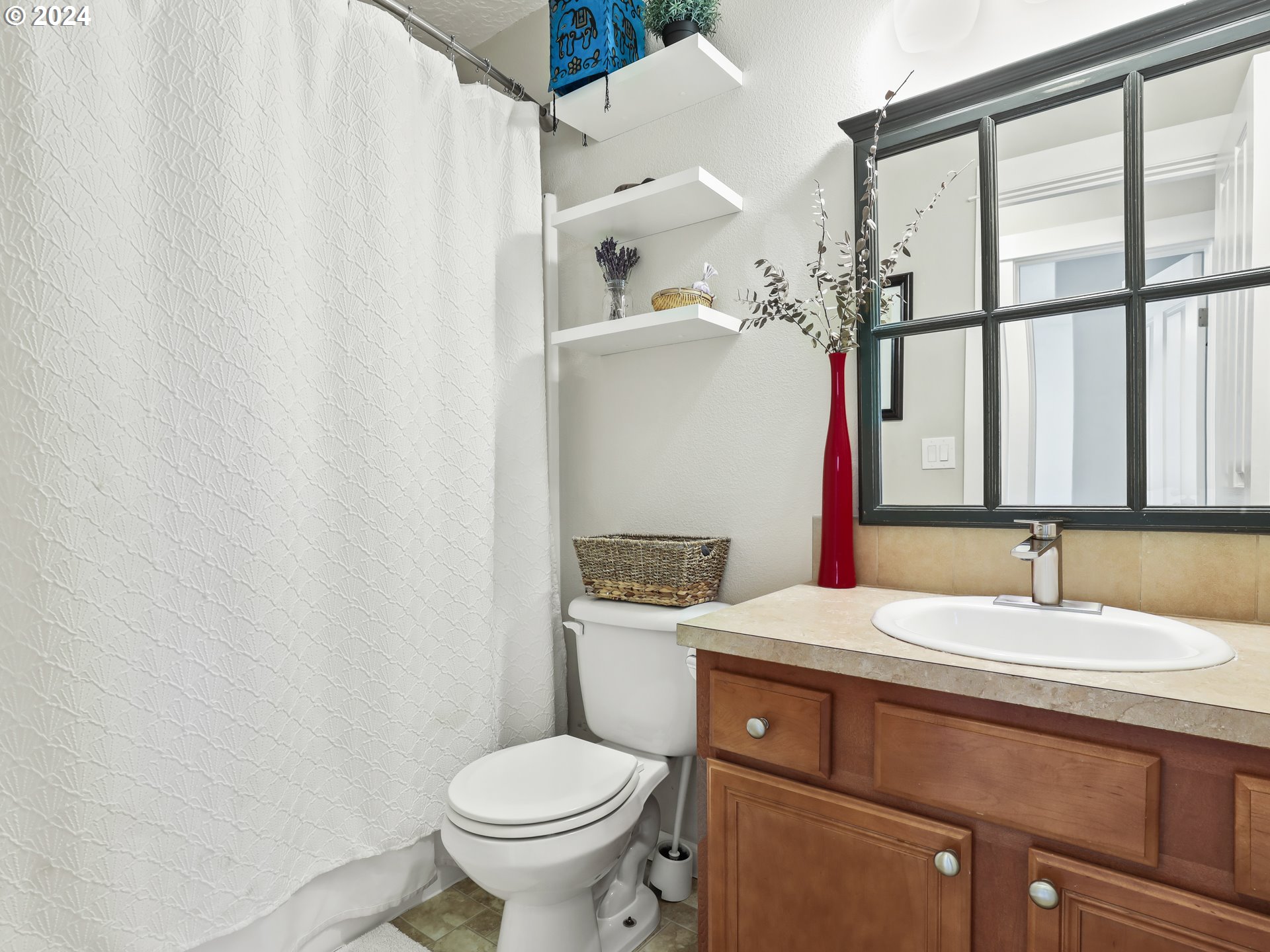 6924 Southeast Boise Street Portland, OR 97206 - Photo 35 of 45 a bathroom with a sink toilet and vanity