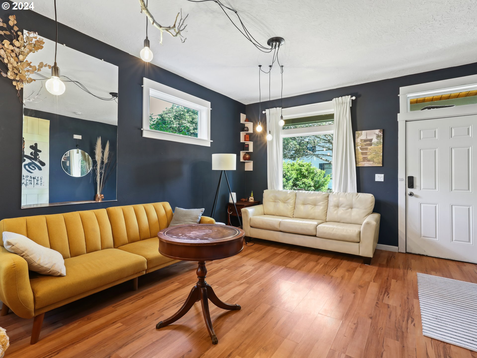 6924 Southeast Boise Street Portland, OR 97206 - Photo 4 of 45 a living room with furniture and a large window