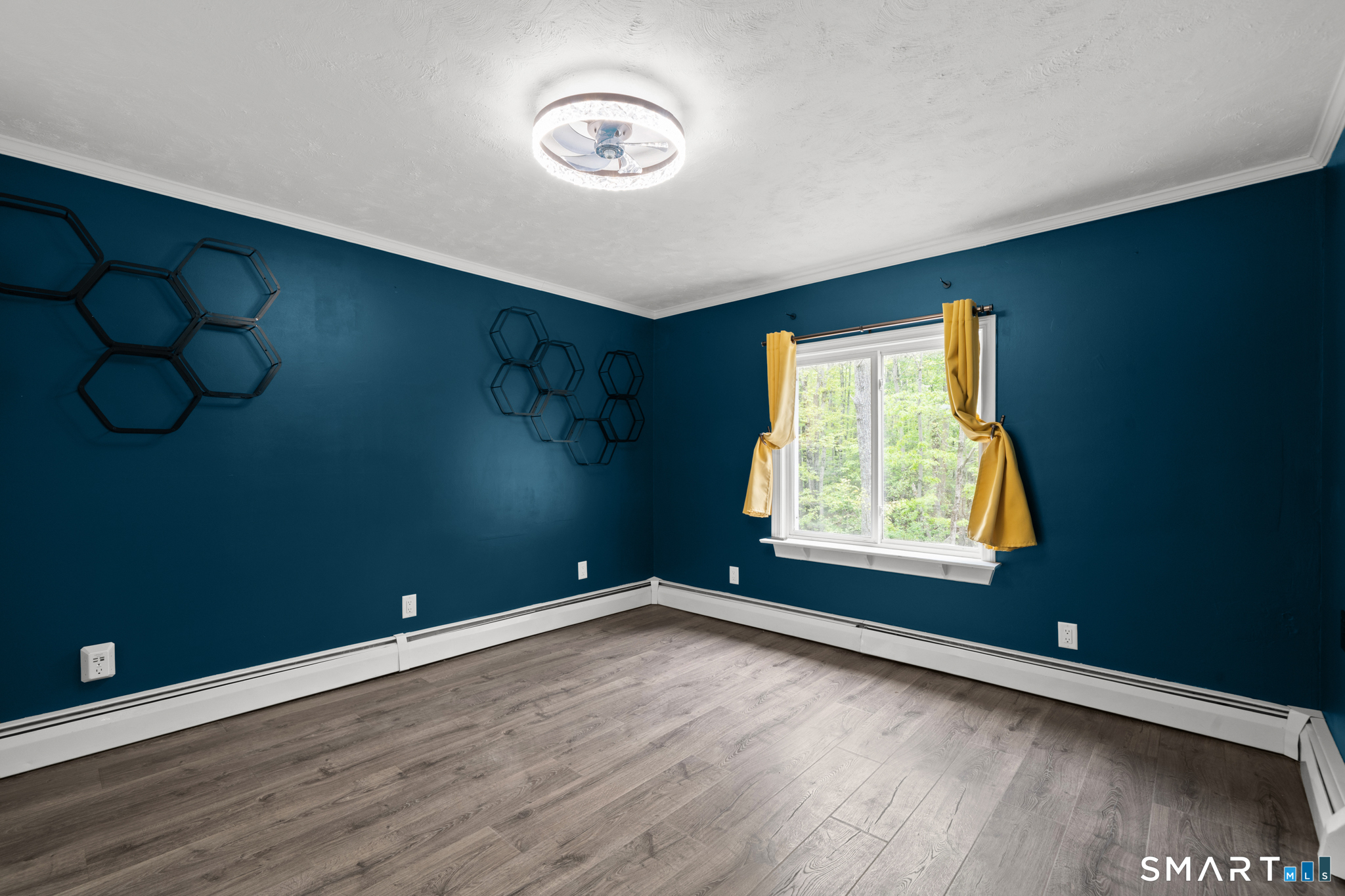 343 Hope Furnace Road Hope, RI 02831 - Photo 13 of 35 an empty room with wooden floor and windows