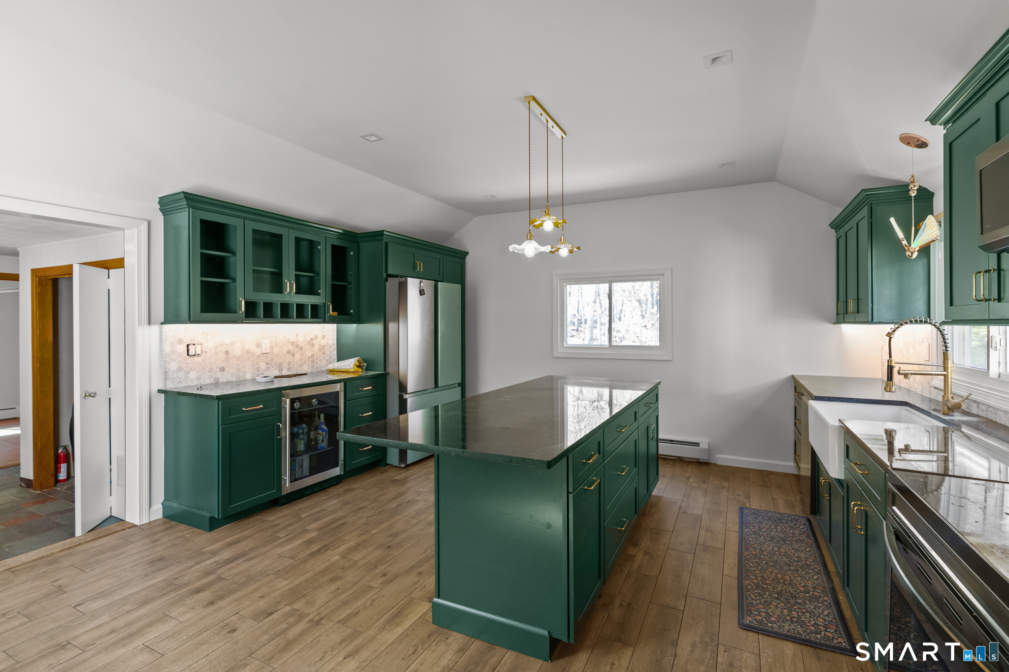 343 Hope Furnace Road Hope, RI 02831 - Photo 29 of 35 a kitchen with kitchen island a sink stainless steel appliances and cabinets