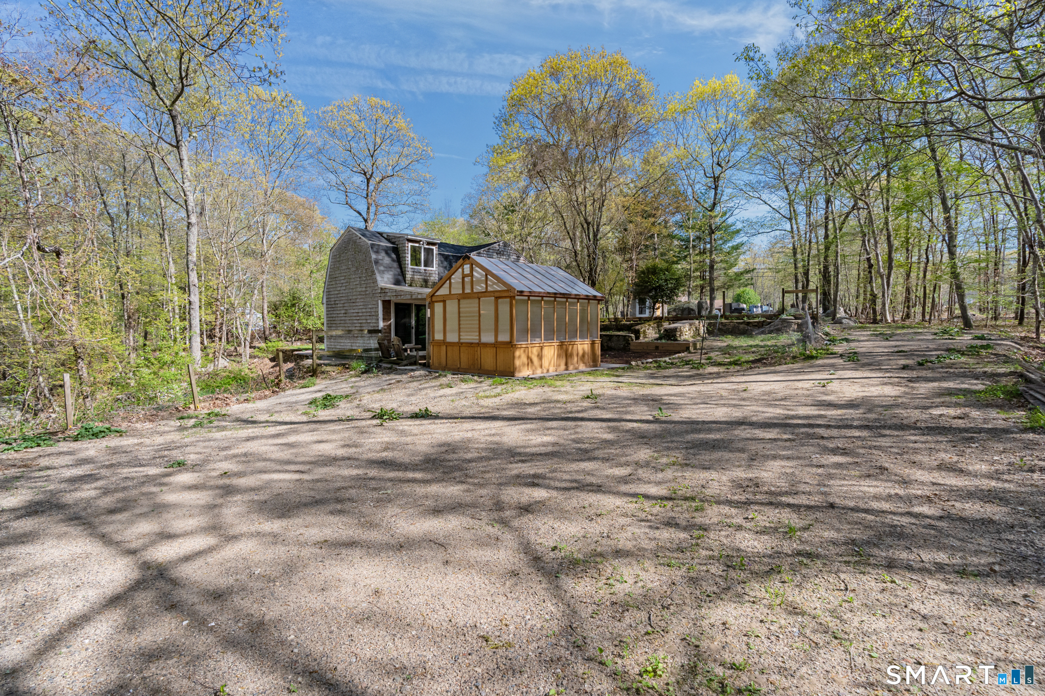 343 Hope Furnace Road Hope, RI 02831 - Photo 33 of 35 a backyard of a house with large trees and outdoor seating