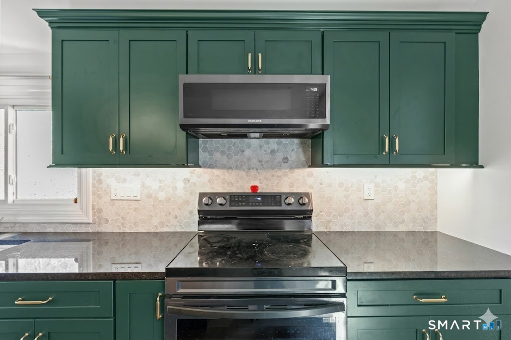 343 Hope Furnace Road Hope, RI 02831 - Photo 4 of 35 a kitchen with a refrigerator and a microwave