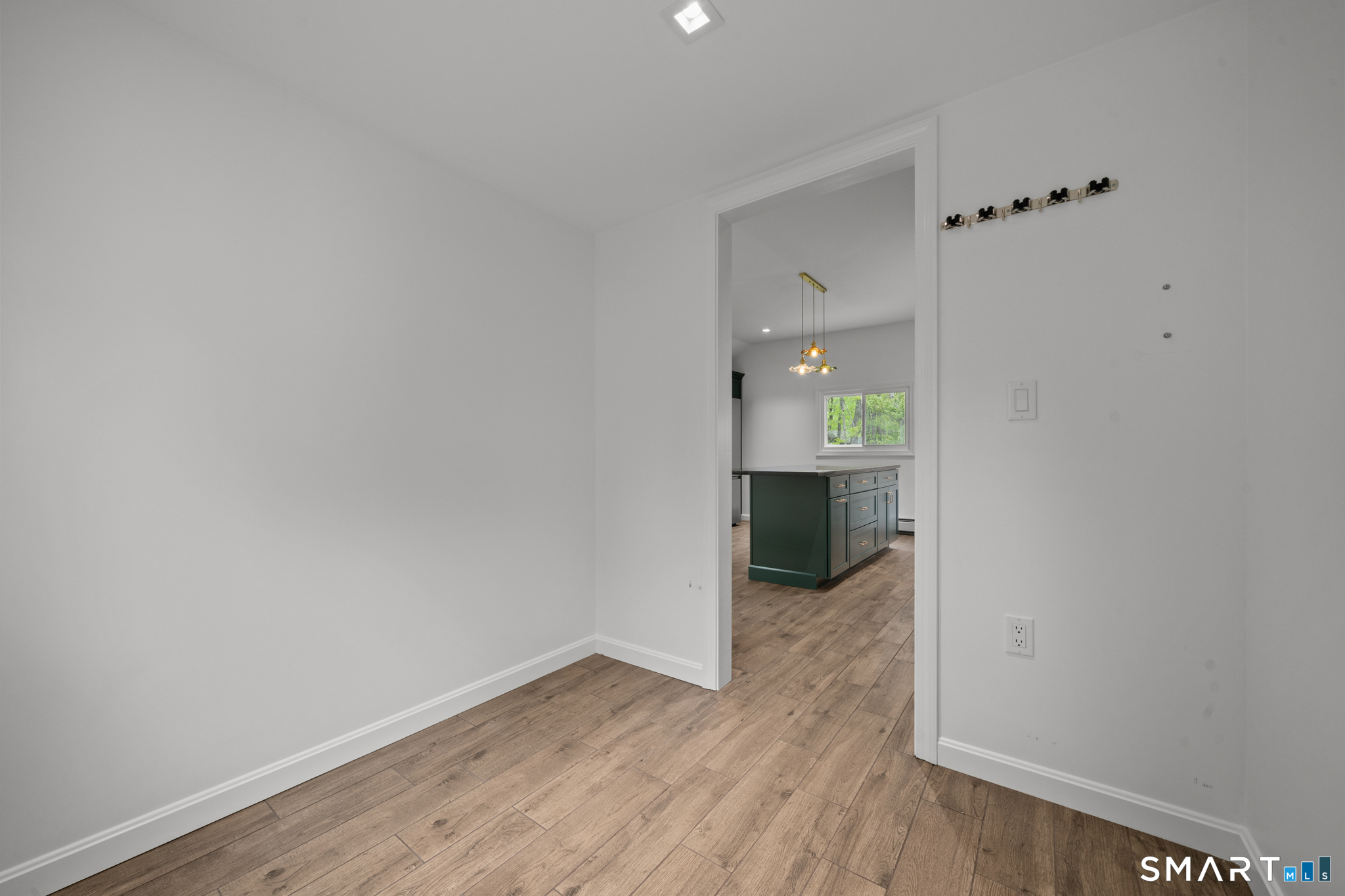 343 Hope Furnace Road Hope, RI 02831 - Photo 7 of 35 wooden floor in an empty room with a window